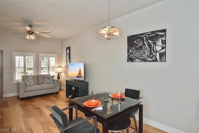 dining area featuring light hardwood / wood-style flooring and ceiling fan