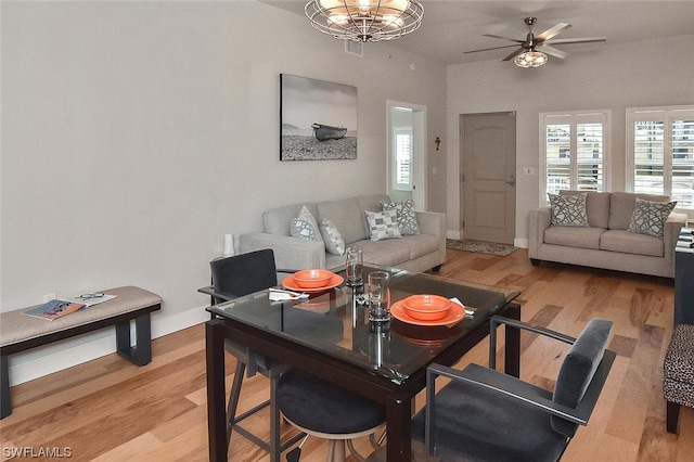 dining area with light hardwood / wood-style flooring and ceiling fan