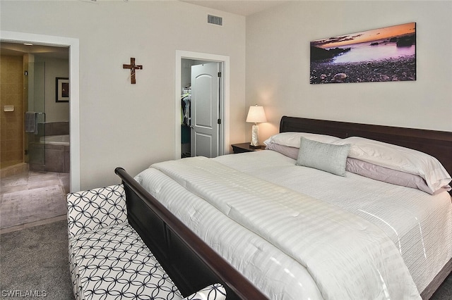 carpeted bedroom featuring connected bathroom