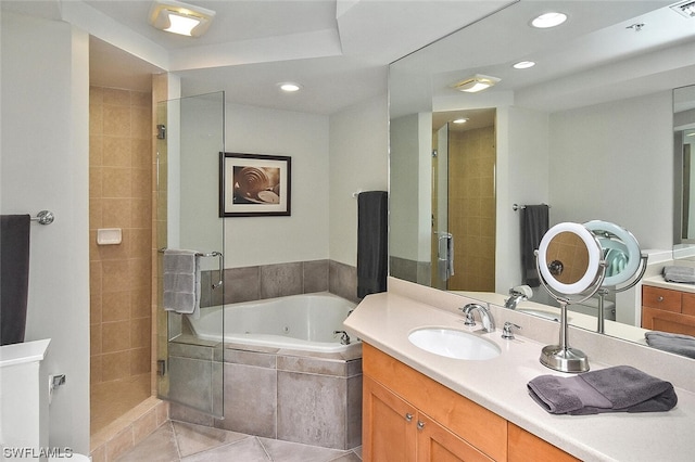 bathroom with vanity, shower with separate bathtub, and tile patterned floors