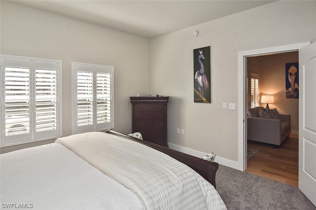 bedroom with hardwood / wood-style flooring