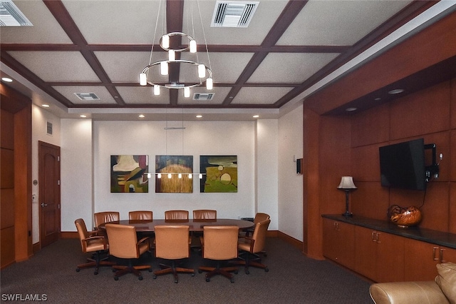 dining space with carpet floors, coffered ceiling, and a chandelier