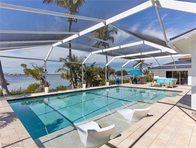 view of pool with a patio and glass enclosure