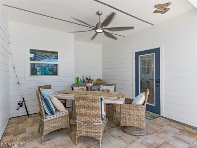 view of patio featuring ceiling fan