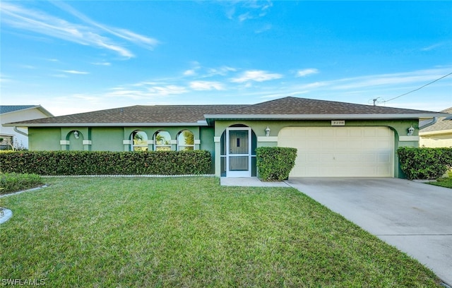 ranch-style home with a front yard and a garage