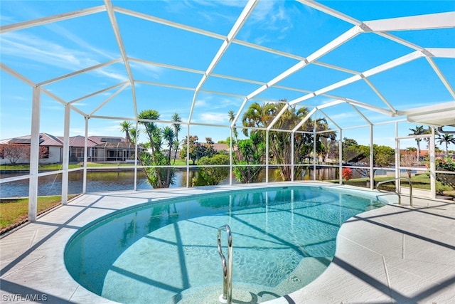 view of pool featuring glass enclosure