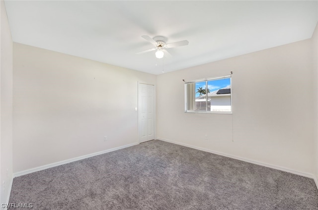 carpeted empty room with ceiling fan