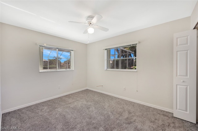 carpeted empty room with ceiling fan