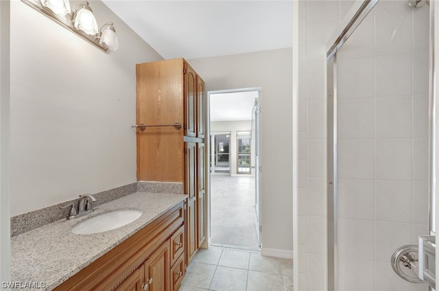 bathroom featuring tile flooring and vanity