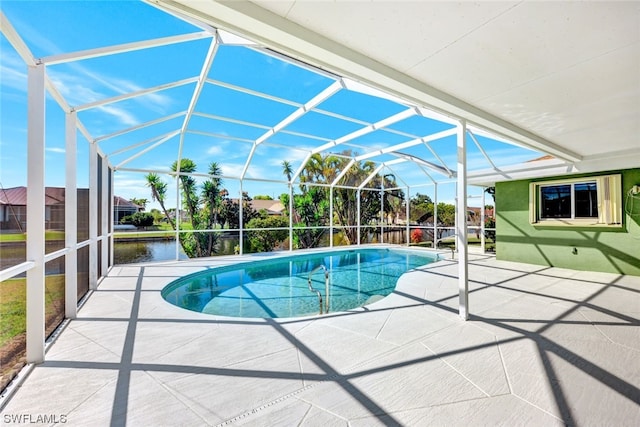 view of swimming pool with a water view, a lanai, and a patio