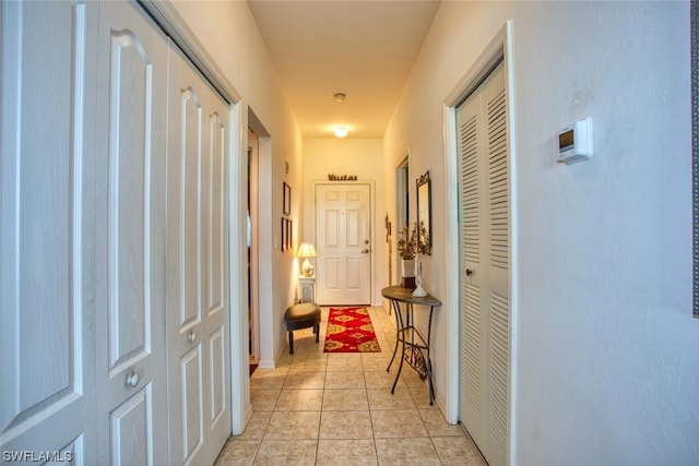 hall with light tile flooring