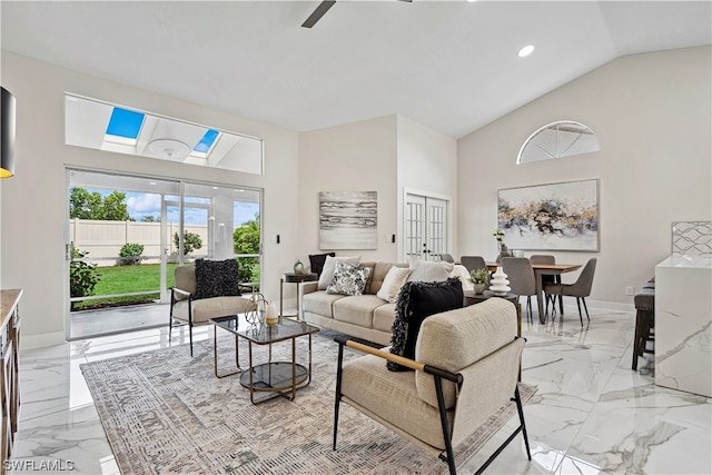 living room featuring ceiling fan and high vaulted ceiling