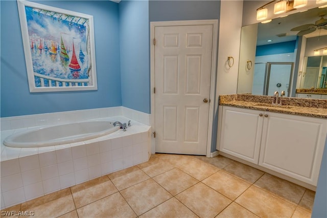 bathroom featuring tile patterned flooring, shower with separate bathtub, vanity, and ceiling fan