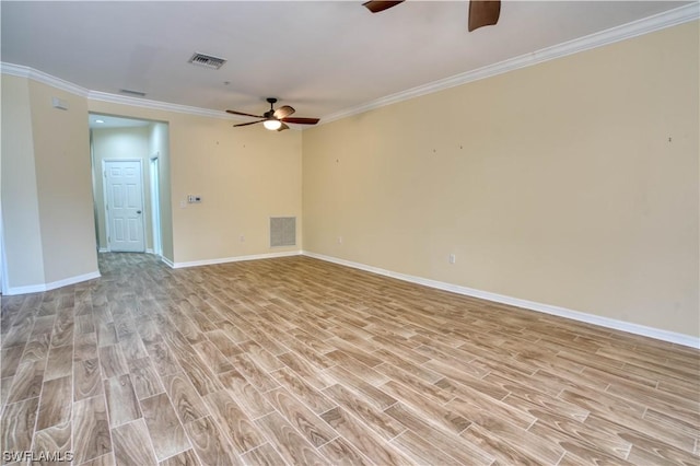 spare room featuring crown molding, ceiling fan, and light hardwood / wood-style floors