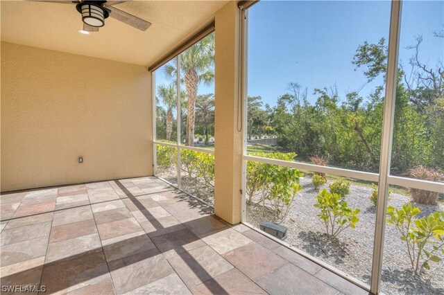 exterior space featuring ceiling fan