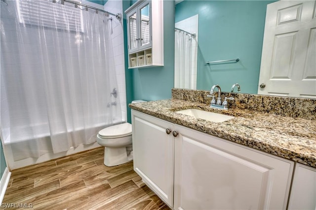 full bathroom with vanity, toilet, and shower / bath combo with shower curtain