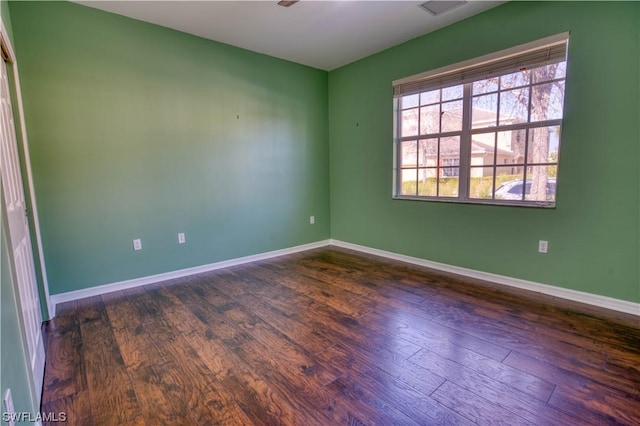 empty room featuring dark hardwood / wood-style floors