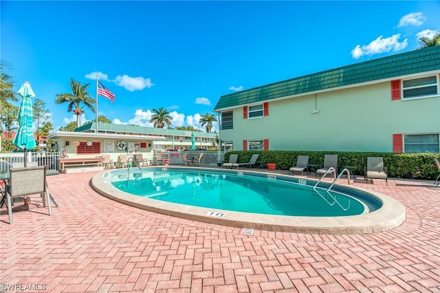 view of swimming pool with a patio