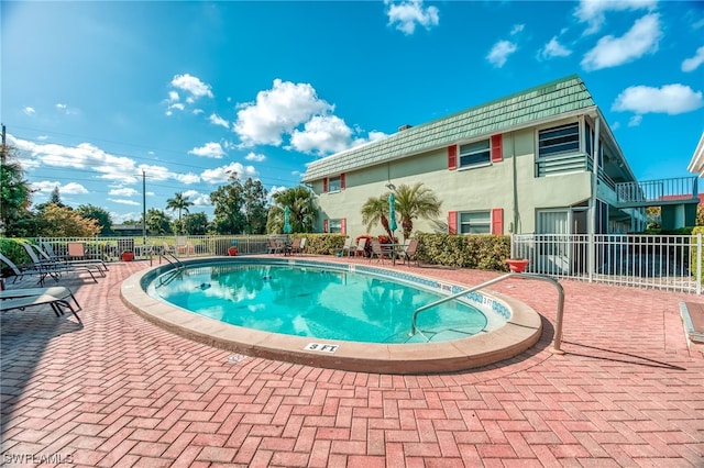 view of swimming pool featuring a patio