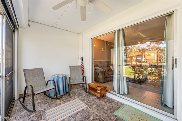 sunroom / solarium with ceiling fan