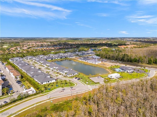 drone / aerial view featuring a water view and a residential view