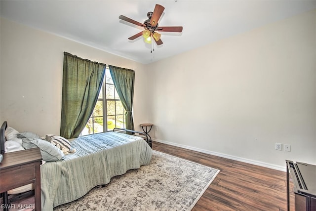 bedroom with hardwood / wood-style floors and ceiling fan