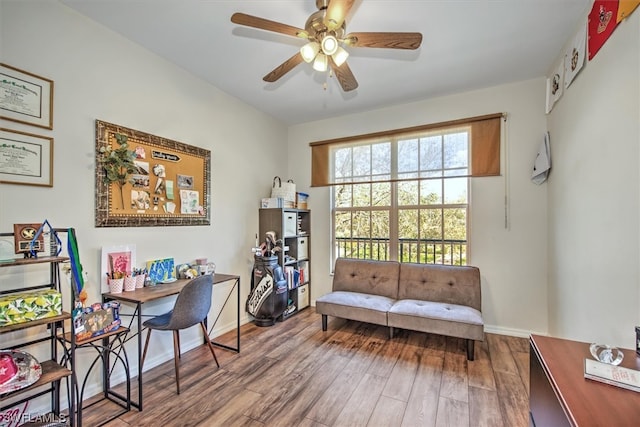 home office featuring dark hardwood / wood-style floors and ceiling fan