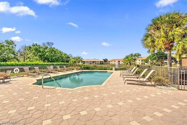 view of swimming pool with a patio