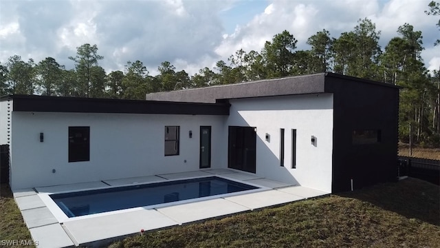 rear view of house with a patio