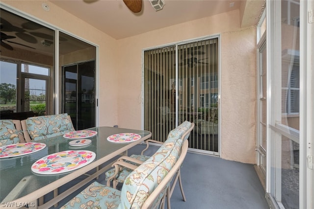 sunroom featuring ceiling fan