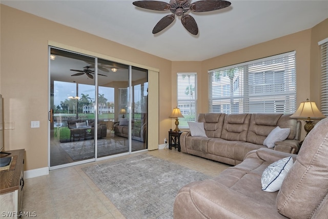 tiled living room with ceiling fan