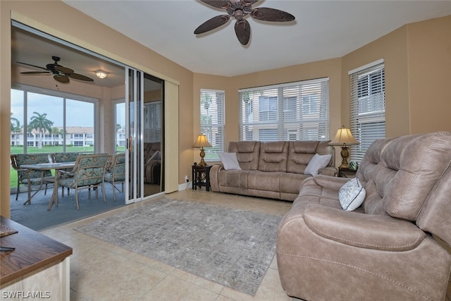 tiled living room with ceiling fan