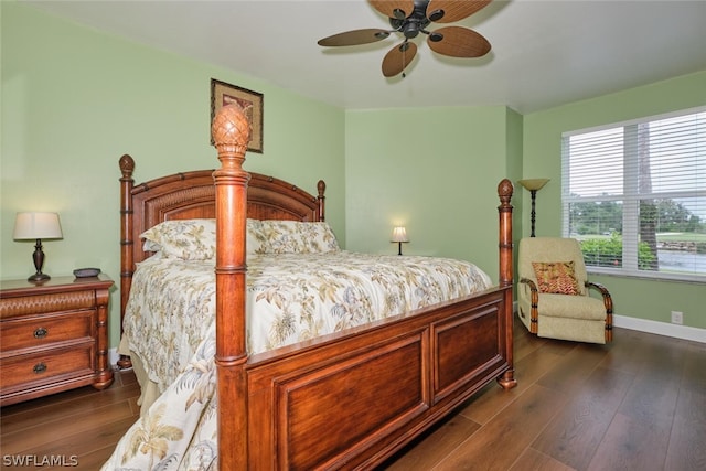 bedroom with ceiling fan and dark hardwood / wood-style floors