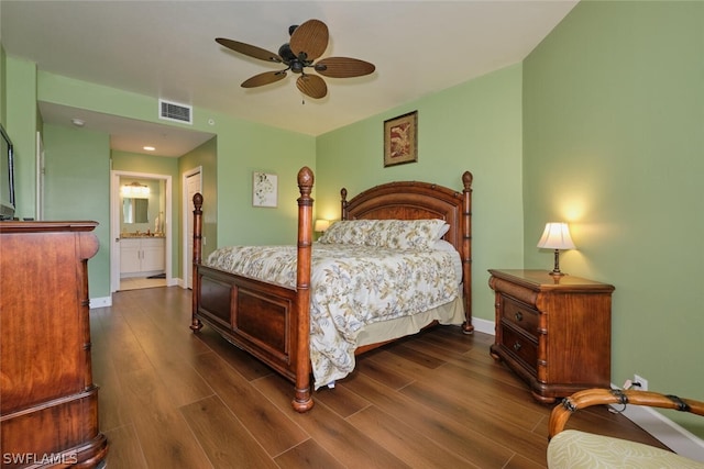 bedroom with ensuite bathroom, ceiling fan, and dark hardwood / wood-style floors