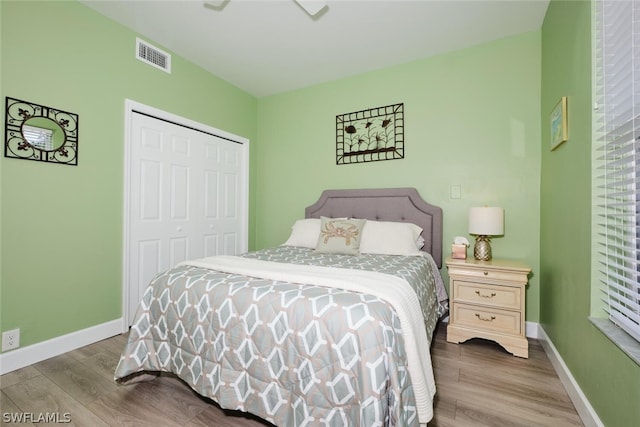 bedroom featuring a closet and wood-type flooring