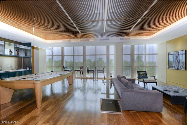 recreation room with wood-type flooring, pool table, and floor to ceiling windows