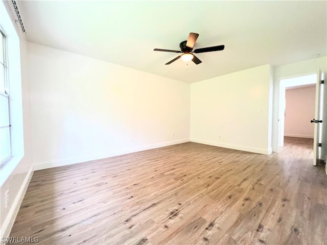 unfurnished room featuring light hardwood / wood-style flooring and ceiling fan