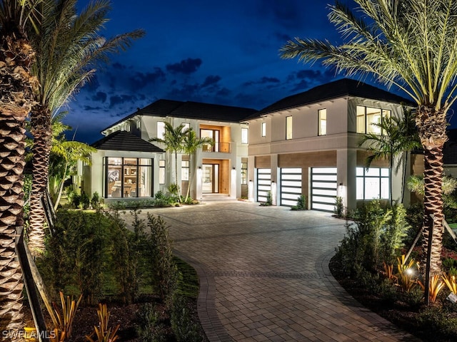 view of front of home featuring a balcony and a carport