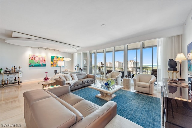 living room featuring a wall of windows