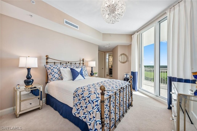 bedroom with a notable chandelier, light carpet, visible vents, baseboards, and access to exterior