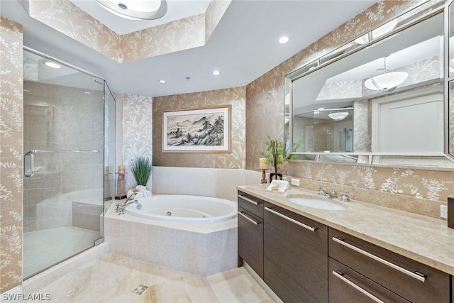 bathroom featuring wallpapered walls, a stall shower, a tub with jets, vanity, and recessed lighting