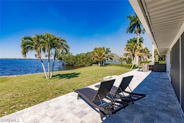 view of patio featuring a water view