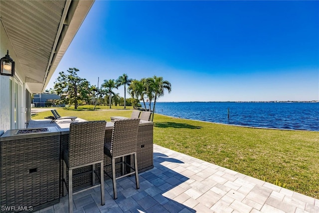 view of patio / terrace featuring a water view