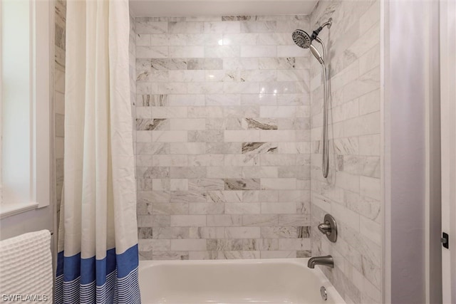 bathroom featuring shower / bathtub combination with curtain