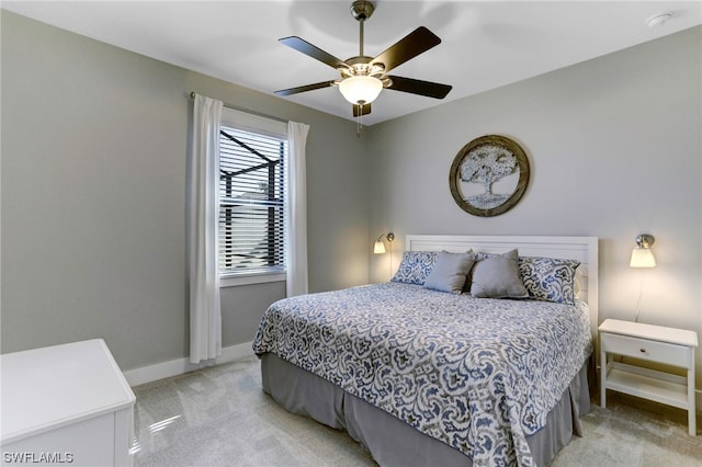 bedroom featuring light carpet and ceiling fan