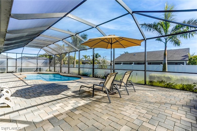 view of pool with a lanai and a patio