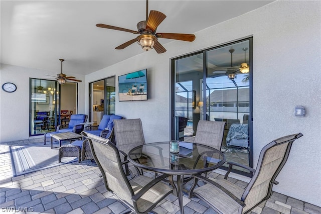 view of terrace featuring ceiling fan