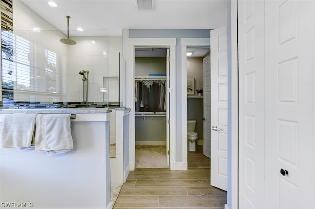 bathroom featuring toilet and hardwood / wood-style flooring