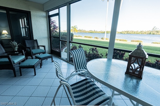 sunroom with a water view