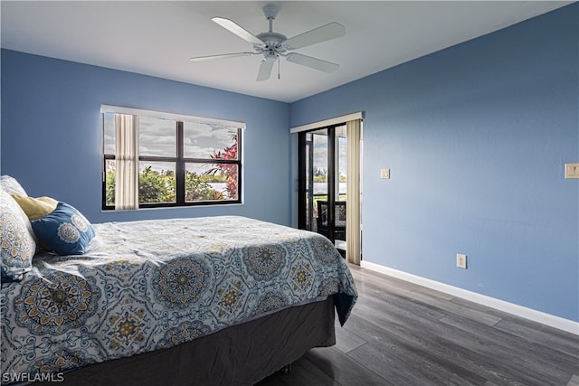 bedroom with access to outside, dark hardwood / wood-style flooring, ceiling fan, and multiple windows